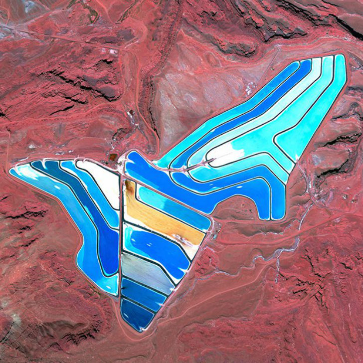Blue evaporation ponds are visible at the Intrepid Potash Mine in Moab Utah USA