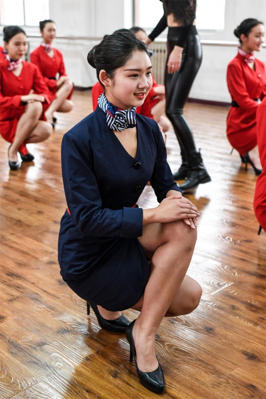Фотография: Как китайских стюардесс учат улыбаться, ходить, стоять и сидеть №7 - BigPicture.ru