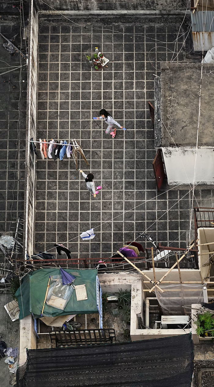 Фотография: Француз подглядывает за жителями Гонконга на крышах небоскребов №6 - BigPicture.ru