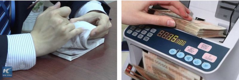 Фотография: Очумелые ручки: две кассирши китайских банков установили мировой рекорд по скоростному пересчитыванию купюр №1 - BigPicture.ru