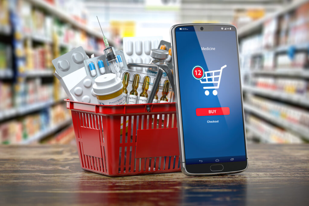 Mobile service or app for purchasing medicines in online pharmacy drugstore. smartphone and shopping basket full of medicines.