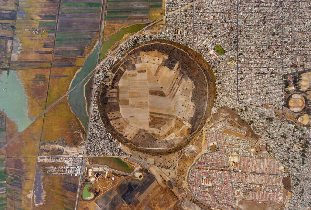 Aerial view of city surrounding extinct volcano xico, mexico