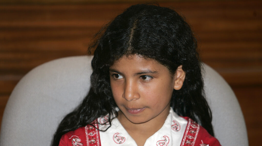 Nine-year-old Nujood al-Ahdal, whose marriage was terminated by a court last week, attends a news conference with her lawyer Shatha Nasser in Sanaa April 21, 2008. REUTERS/Khaled Abdullah (YEMEN) - GM1E44M0L1U01