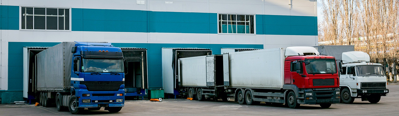 Trucks loading in warehouse for cargo transportation