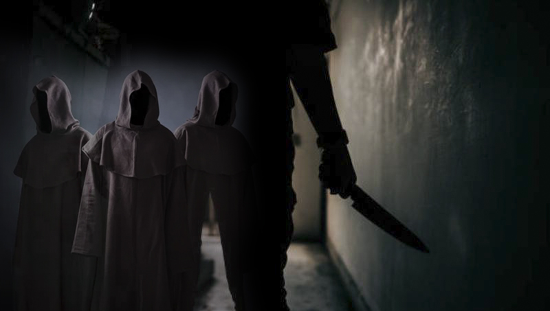The shadow of a female murderer stood terrifyingly holding a knife