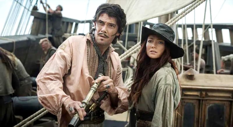 Калико Джек Рэкхем и Энн Бонни на фоне пиратского корабля