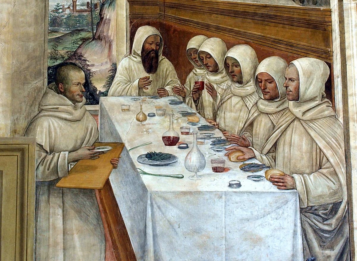 Монахи в белых рясах за обедом средневековая живопись