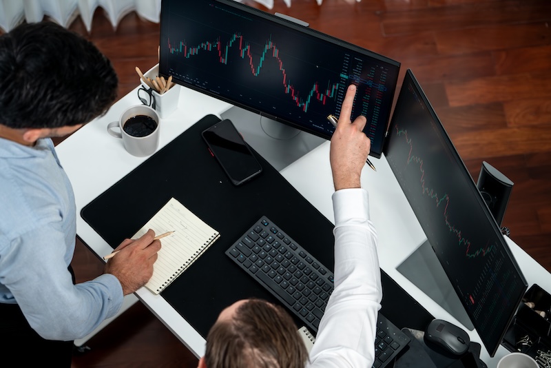 Business professional brokers discussing stock market on pc screen. sellable.