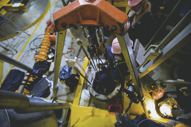 Top view male climb up the stairs into the tank stainless chemic