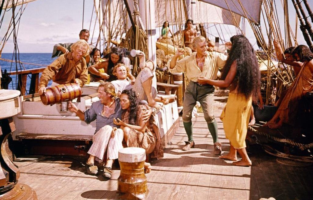 Моряки с туземками на борту корабля