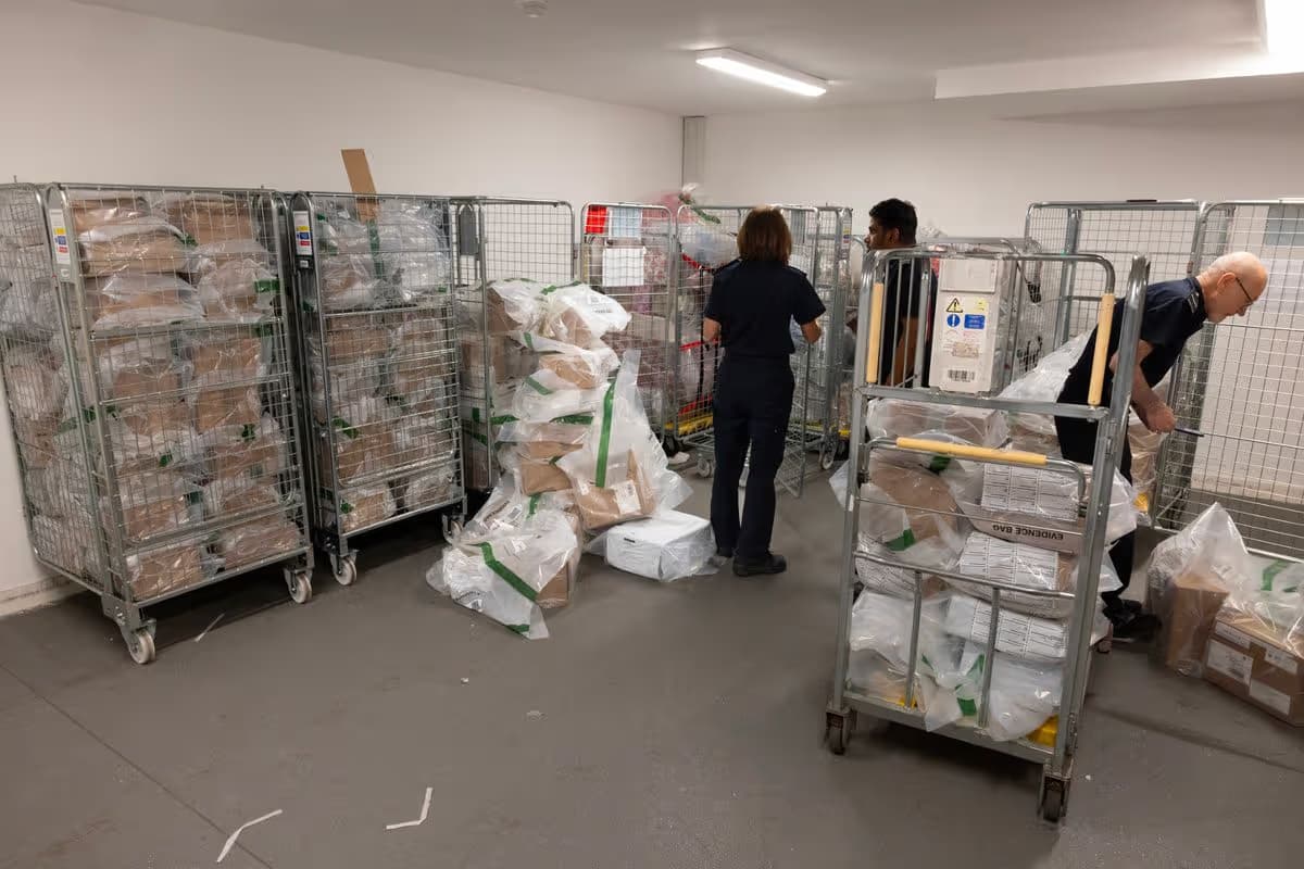 Packages of cannabis are piled up inside a storeroom at the depot