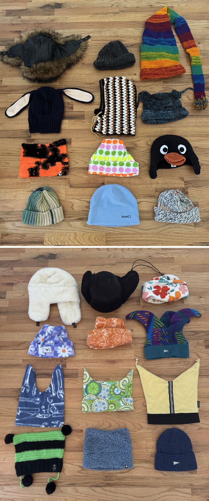 Разнообразные вязаные шапки, шарфы, варежки и ушанки разложены на деревянном полу