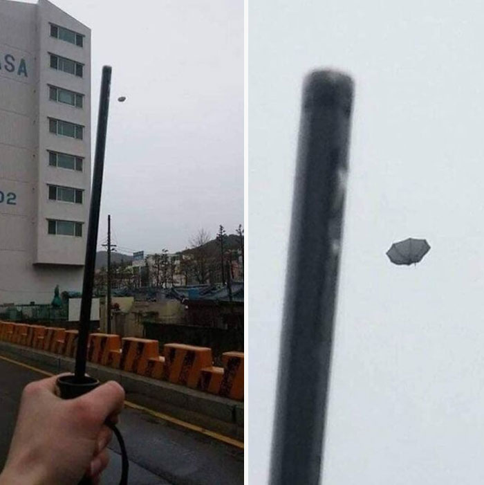 Ручка зонта в руке и зонт улетает в небо
